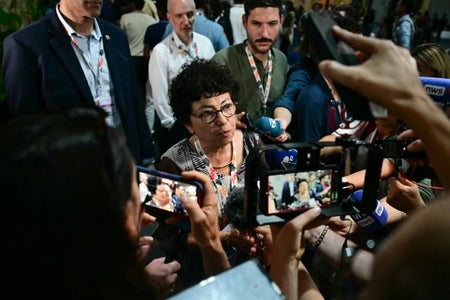 People being interviewed in front of cameras.