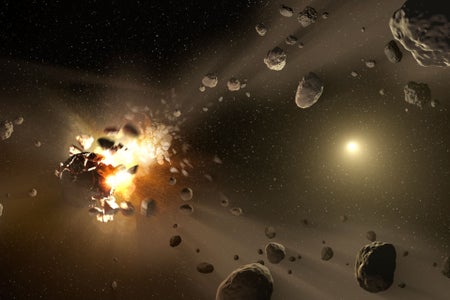 Fragments radiate outward in the aftermath of a deep-space collision between two asteroids. The Sun can be seen in the distance as a small yellow orb.