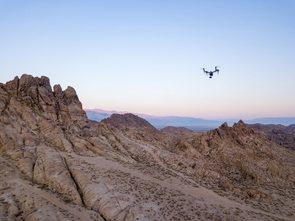 A drone flying above rock formations