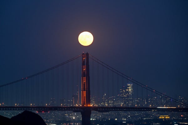 Supermoon rising over Golden Gate Bridge