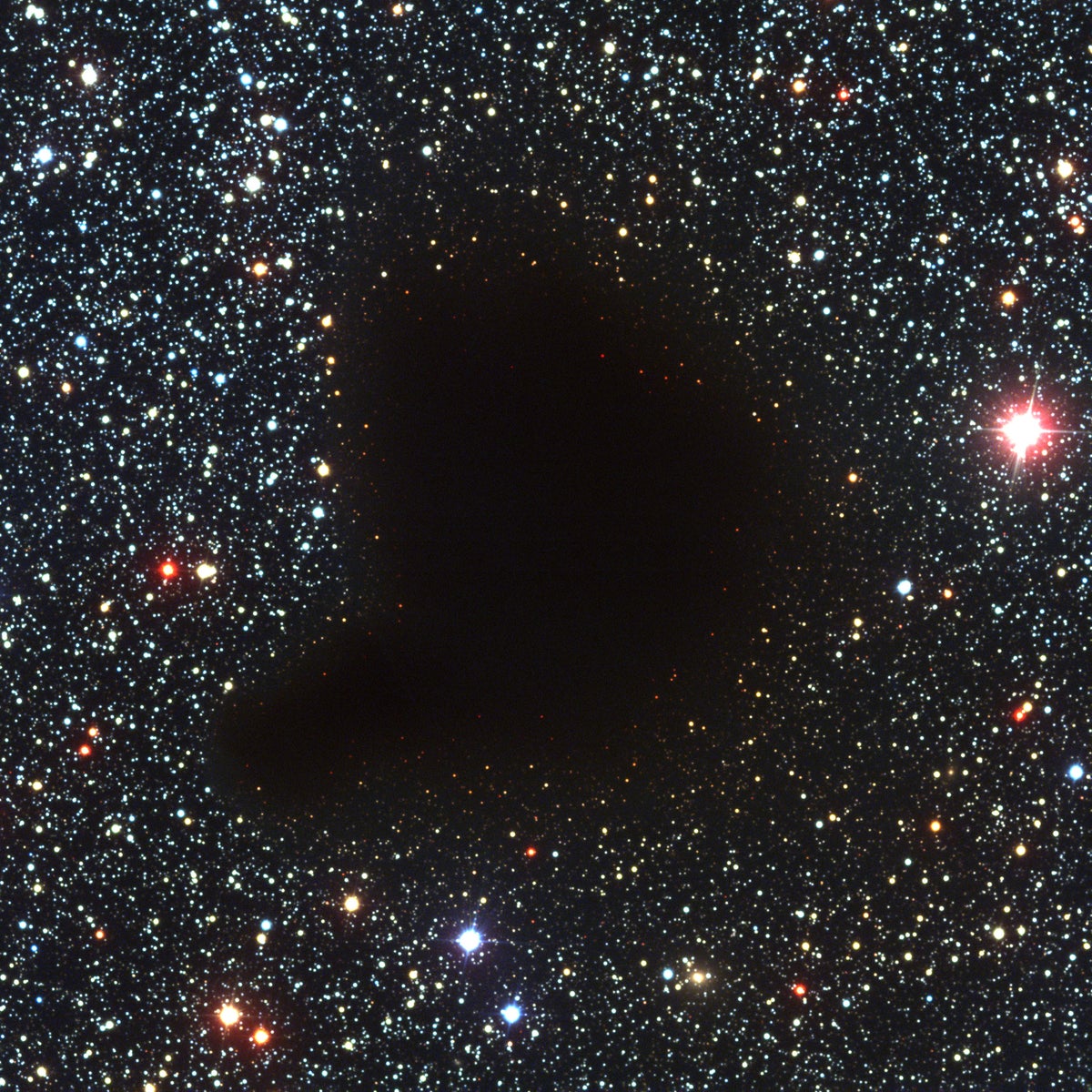 This photograph shows an unusual sky field in the Milky Way band. It is centered on one of the classical, dark globules, known as Barnard 68 (B68). It appears as a compact, opaque and rather sharply defined object against a rich, background star field.