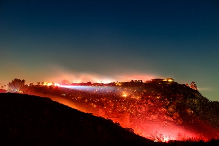 Hillside with fire and night sky