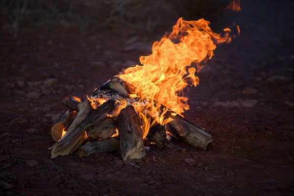 Logs stacked in a campfire