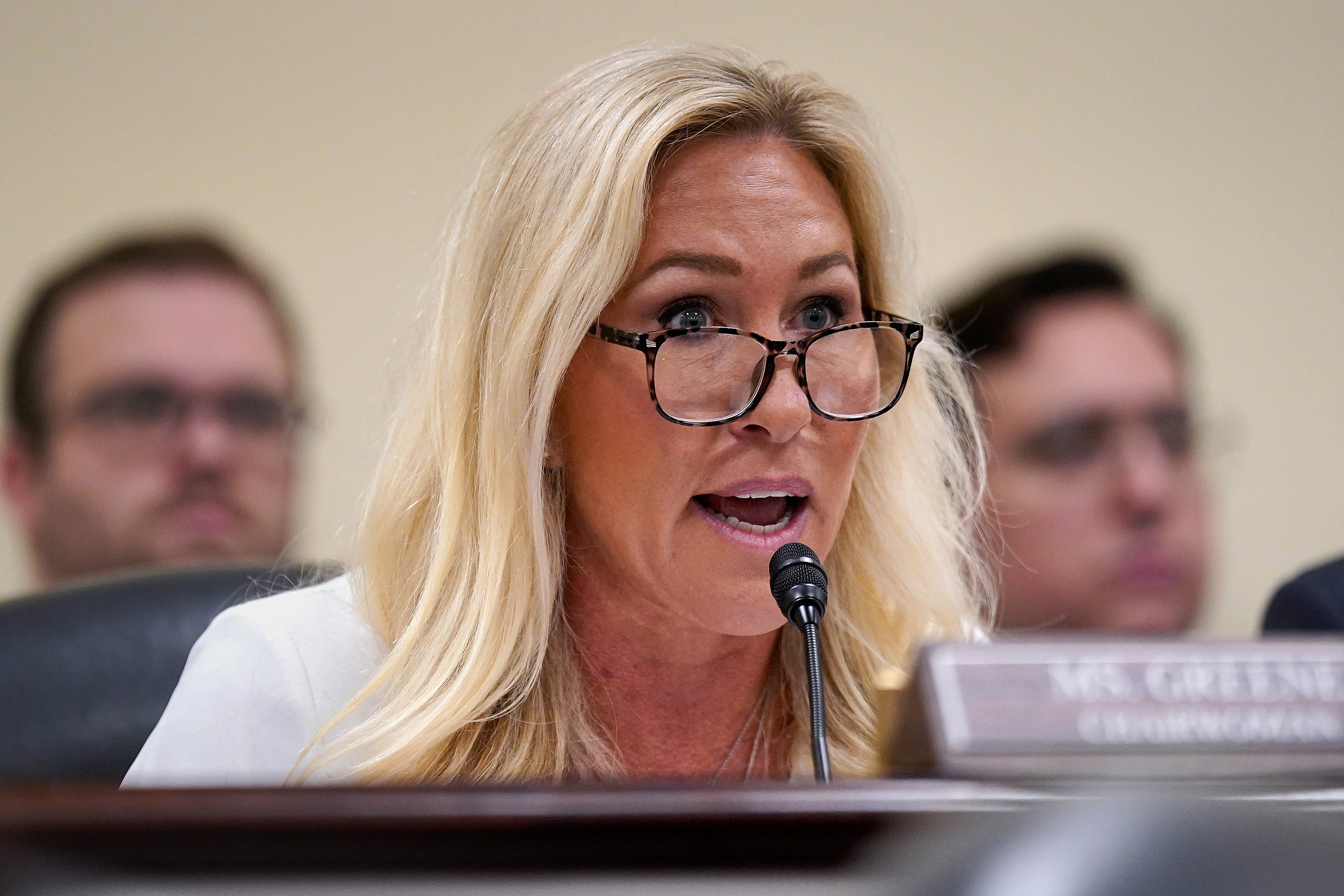 U.S. Rep. Marjorie Taylor Greene (R-SC) speaking into a microphone during a hearing of the House Oversight Subcommittee
