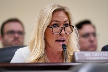 U.S. Rep. Marjorie Taylor Greene (R-SC) speaking into a microphone during a hearing of the House Oversight Subcommittee