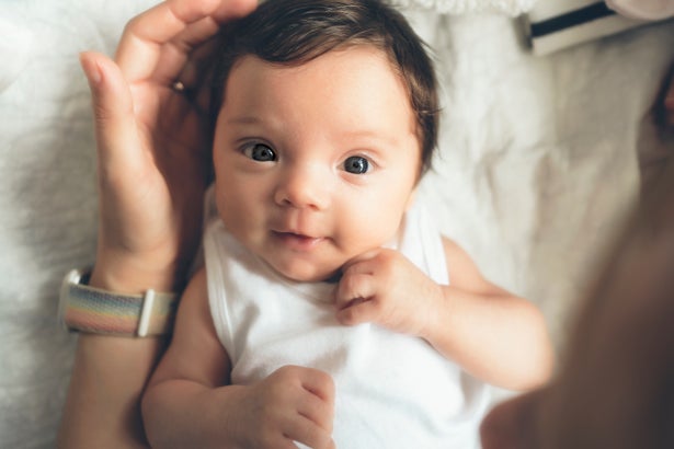Baby making eye contact with his mother