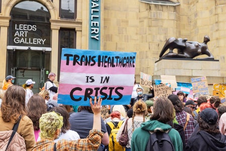 A sign states "Trans Healthcare is in Crisis" as protestors gathered outside Leeds art gallery to protest against the CASS report into medical treatment for transgender children and young adults, the demonstration was attended by about 250 people