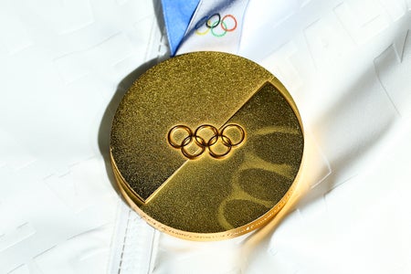 A close-up of the Milan Cortina 2026 Olympics gold medal
