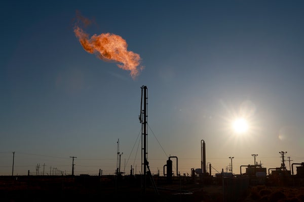 Natural gas flaring at oil drilling facility.