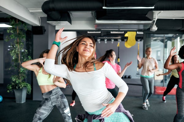 Group of women enjoying dance fitness together in the gym.