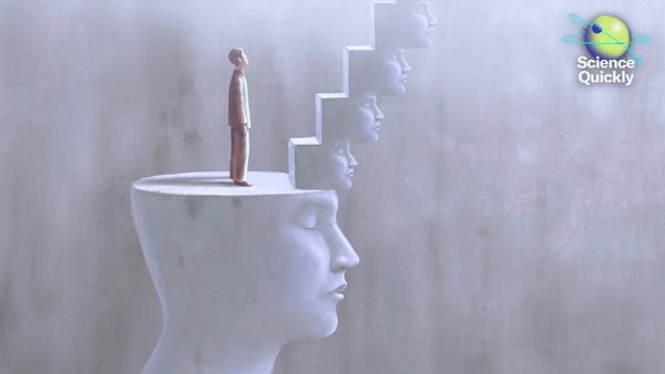 An illustration of a man standing on a platform carved out of a stone head with a staircase of smaller stone heads leading up towards a light