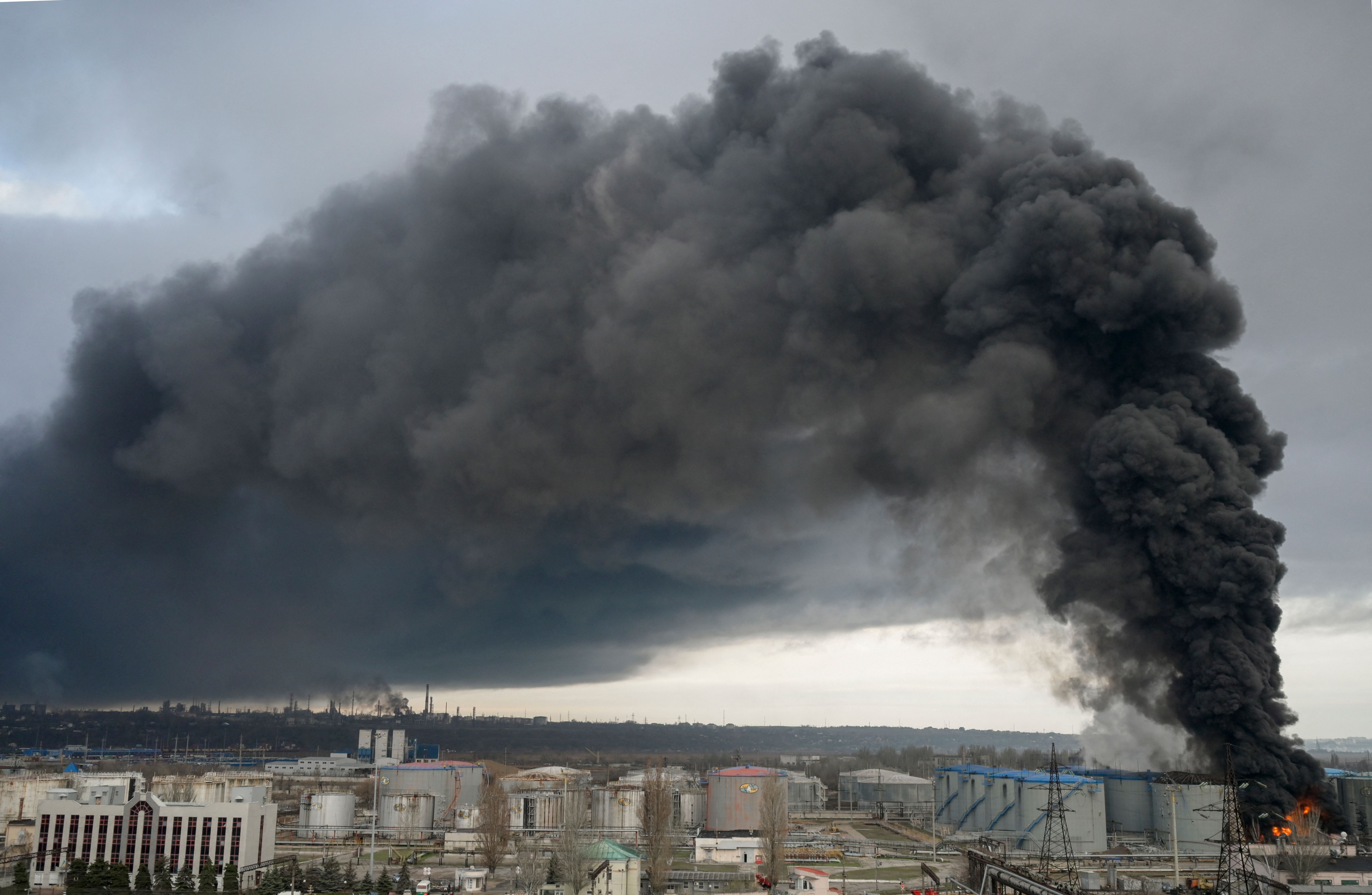 Black smoke behind Odessa skyline after russian attack.