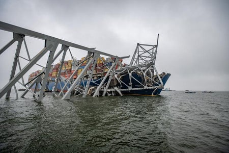 The container ship Dali is seen in the wreckage of Francis Scott Key Bridge a week after it hit a structural pier causing a catastrophic bridge collapse, on April 2, 2024.