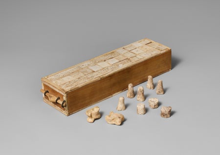 Rectangular game box with drawer and game pieces