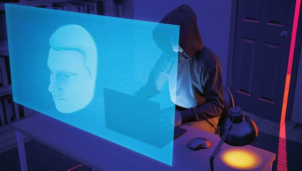 Illustration of a person in a hoodie, covering their face, working on a computer ominously