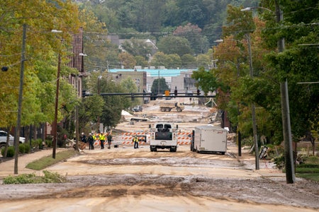 Flood damage and construction vehicles during hurricane Helene.