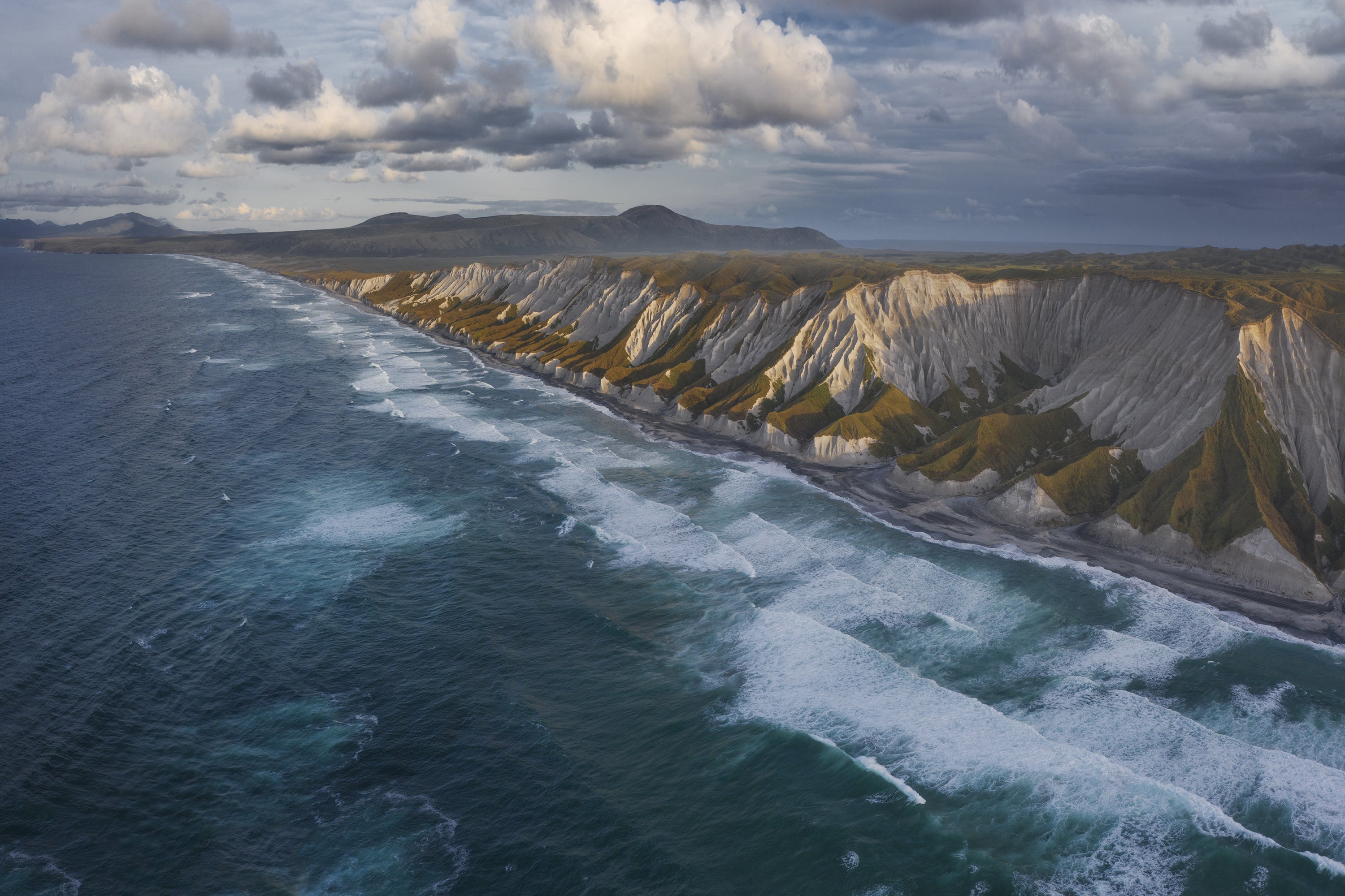A photo from March 2022 shows an aerial view of South Kuril Islands and coastline in Kamchatka region, Russia.