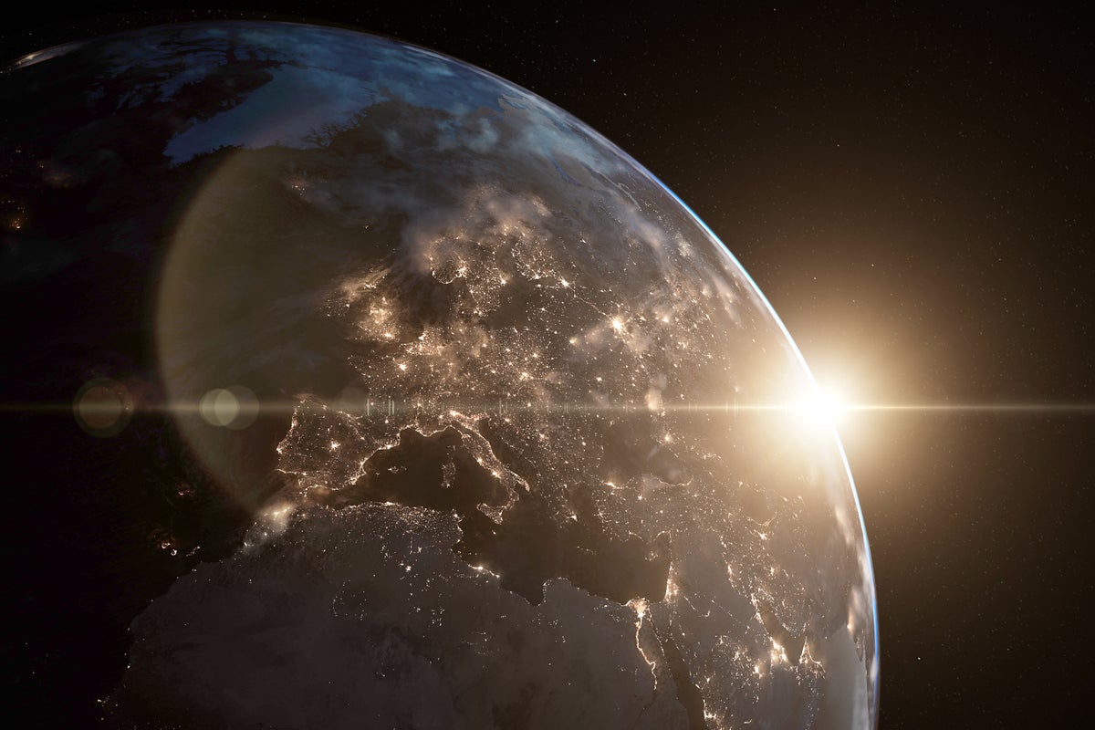 3D rendered image of planet earth, including volumetric clouds illuminated by city lights. Created with textures by NASA