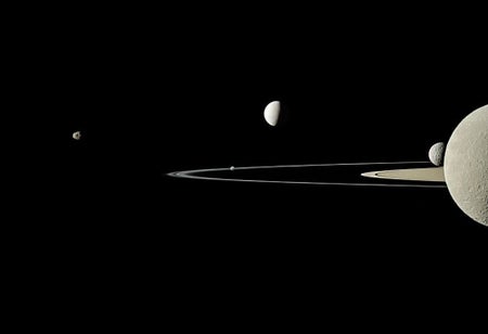 A view of Saturn and five of its moons, as seen by the Cassini orbiter.