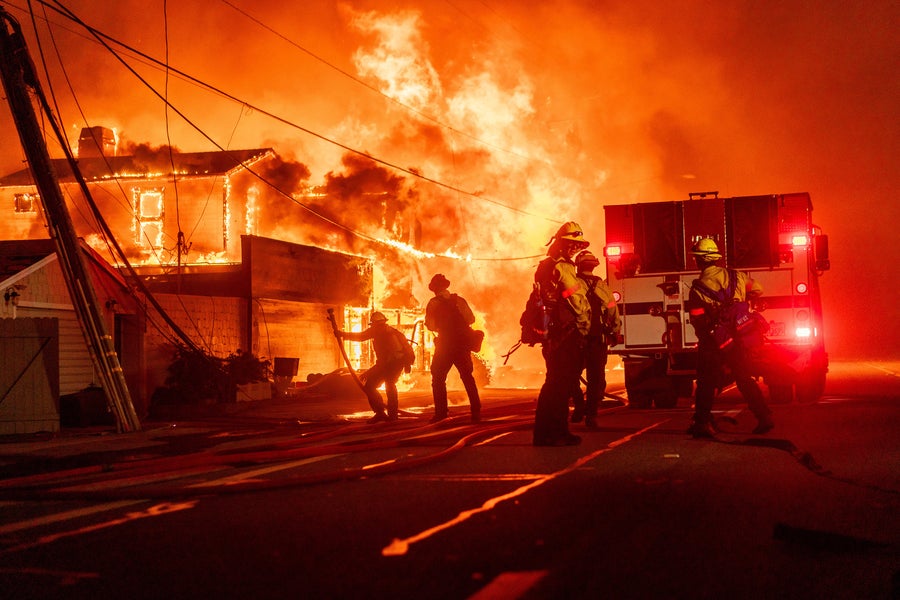Firefighters battle flames during the Palisades Fire in the Pacific Palisades neighborhood of Los Angeles, California, US, on Tuesday, January 7, 2025