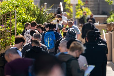 Rear view of people standing in line