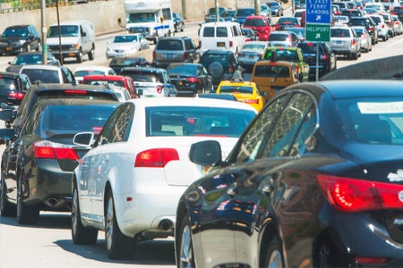 Cars lined up in bumper-to-bumper traffic.