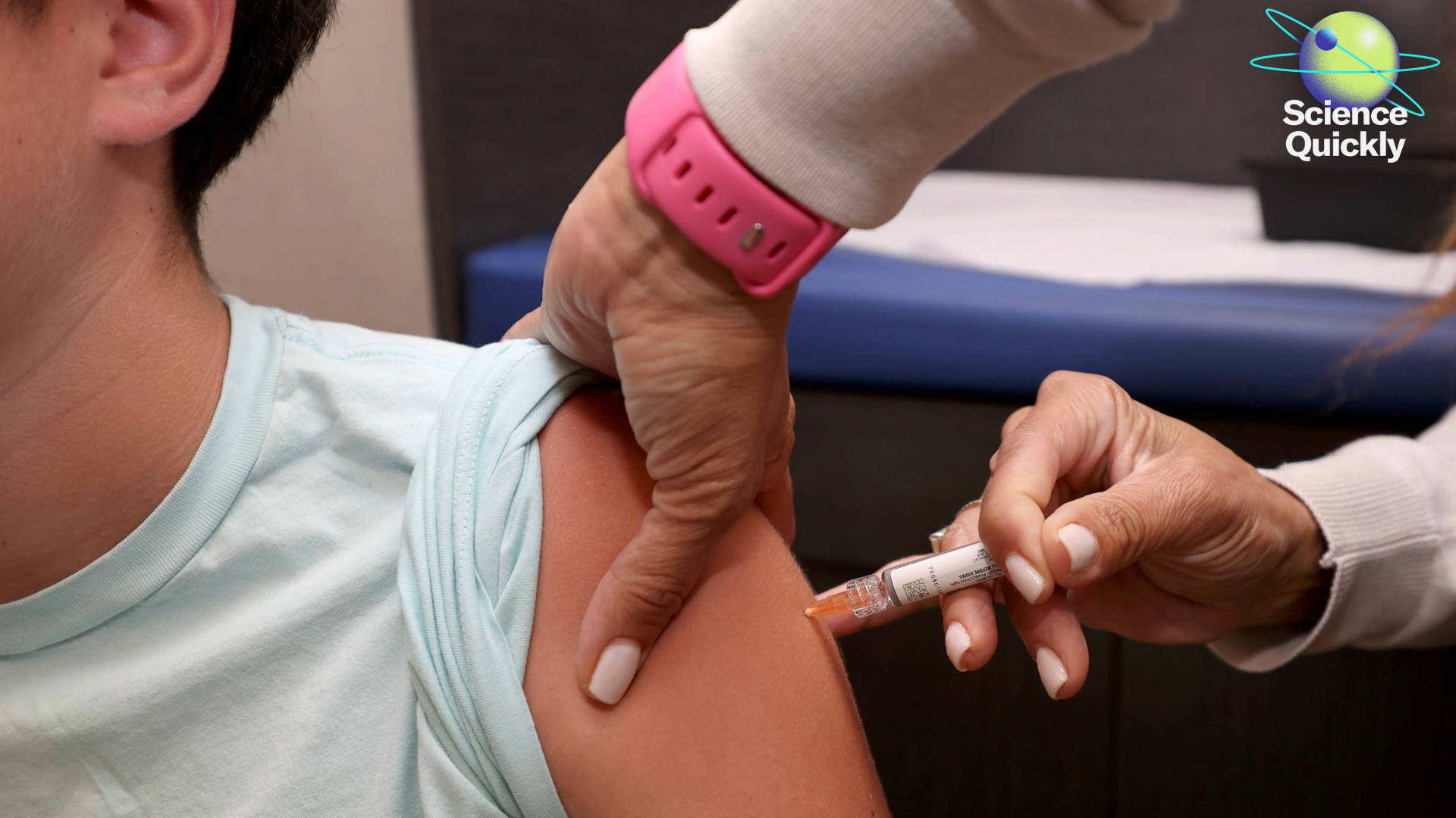 A child receiving an immunization in their arm from a doctor.