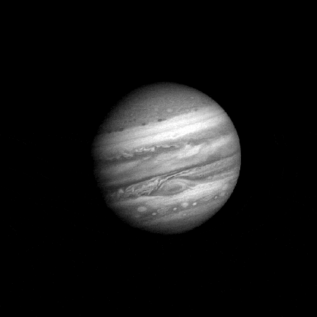 A black-and-white GIF of Jupiter showing difference in speed and direction of the various zones of its atmosphere