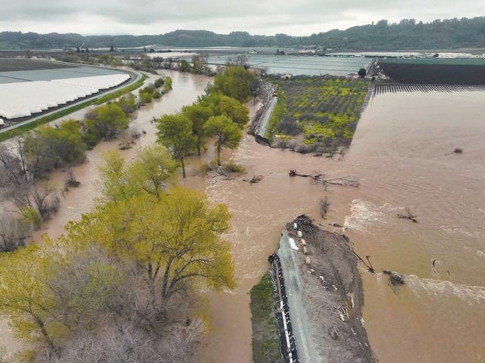 Levee broken by flood water in Pajaro River flood.