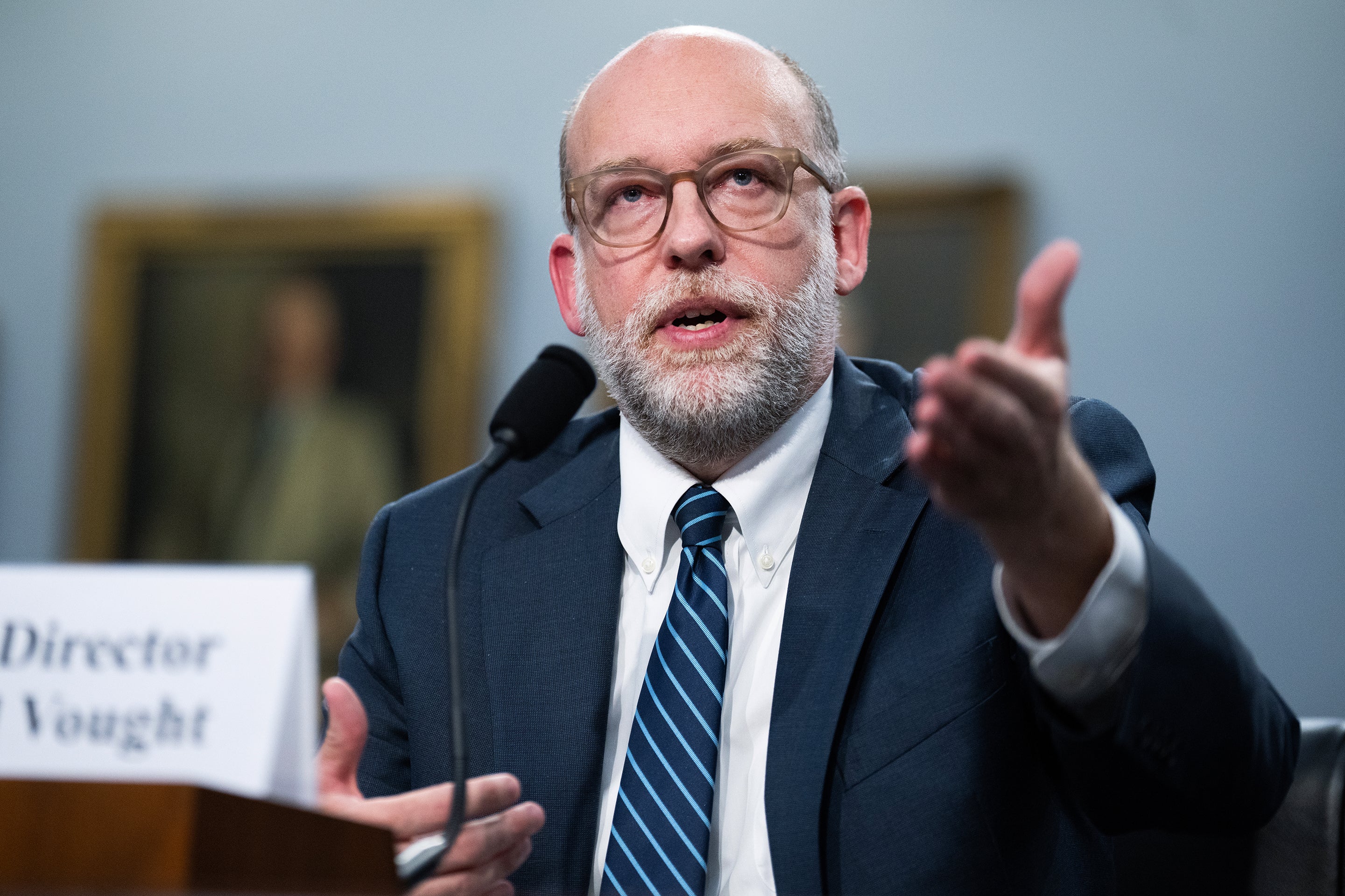 OMB Director Russell Vought sitting and speaking into a microphone while testifying before the House Appropriations Committee in the Rayburn building on June 4, 2025.