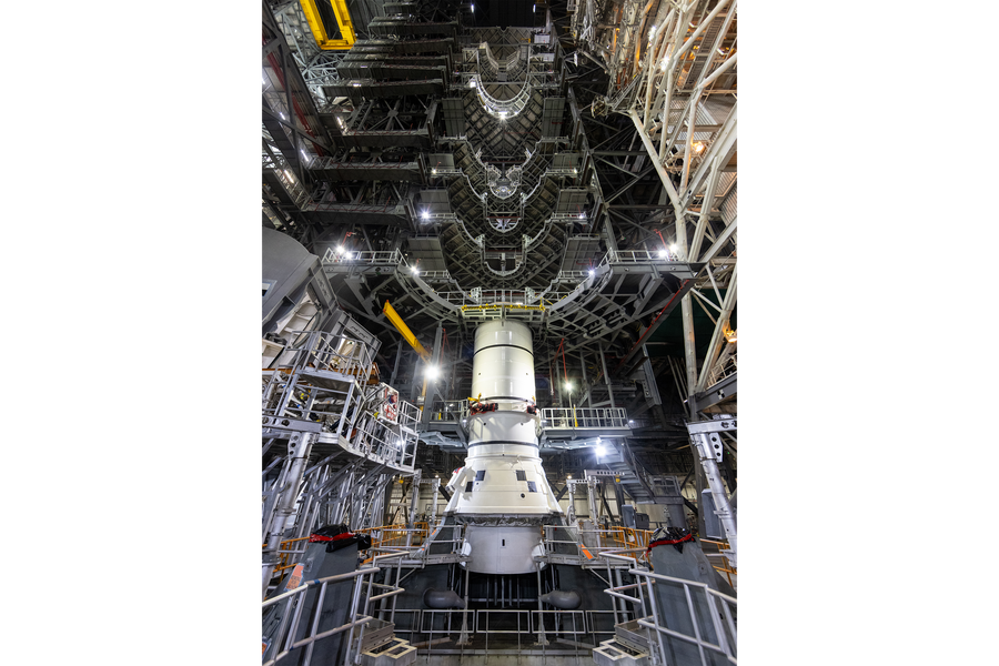 Engineers and technicians with the Exploration Ground Systems Program stack the first Moon rocket segment – the left aft assembly for the Artemis II SLS (Space Launch System) solid rocket booster onto mobile launcher 1 inside the Vehicle Assembly Building at NASA’s Kennedy Space Center on Wednesday, Nov. 20, 2024. Above the boosters that are currently stacked, a space cutout in the working platforms can be seen stretching approximately 7 stories above where the remainder of the rocket will stand once assembly is completed