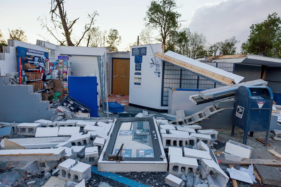 The Clear Creek post office lays in rubble without a roof after a tornado destroyed it
