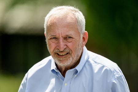 Larry Summer in a blue button shirt