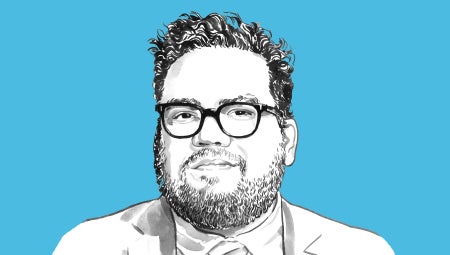 Portrait of Gabriel Gomes against a blue background