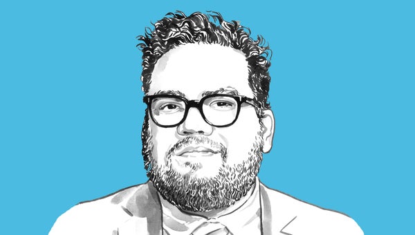 Portrait of Gabriel Gomes against a blue background