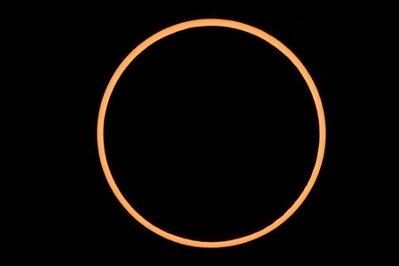 A thin, orange ring outlines a black circle