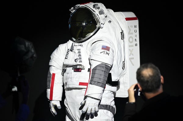 A view of the front top half of an Axiom Space AxEMU spacesuit