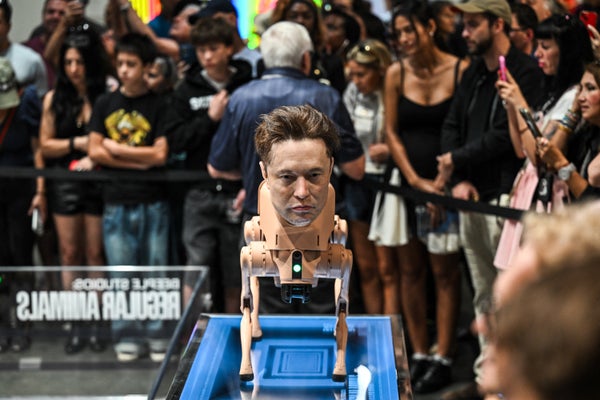 A wax head of Elon Musk is seen on a robot dog as a part of an art installation called "Regular Animals" by digital artist Mike Winkelmann, also known as Beeple, during Art Basel 2025 at Miami Beach Convention Center in Miami Beach, Florida, December 7, 2025.