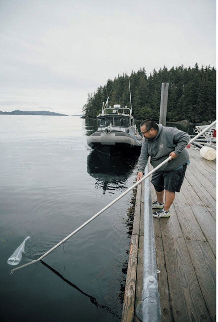 Scientist at the NOAA Kasitsna Bay Lab skims water for tiny organisms.