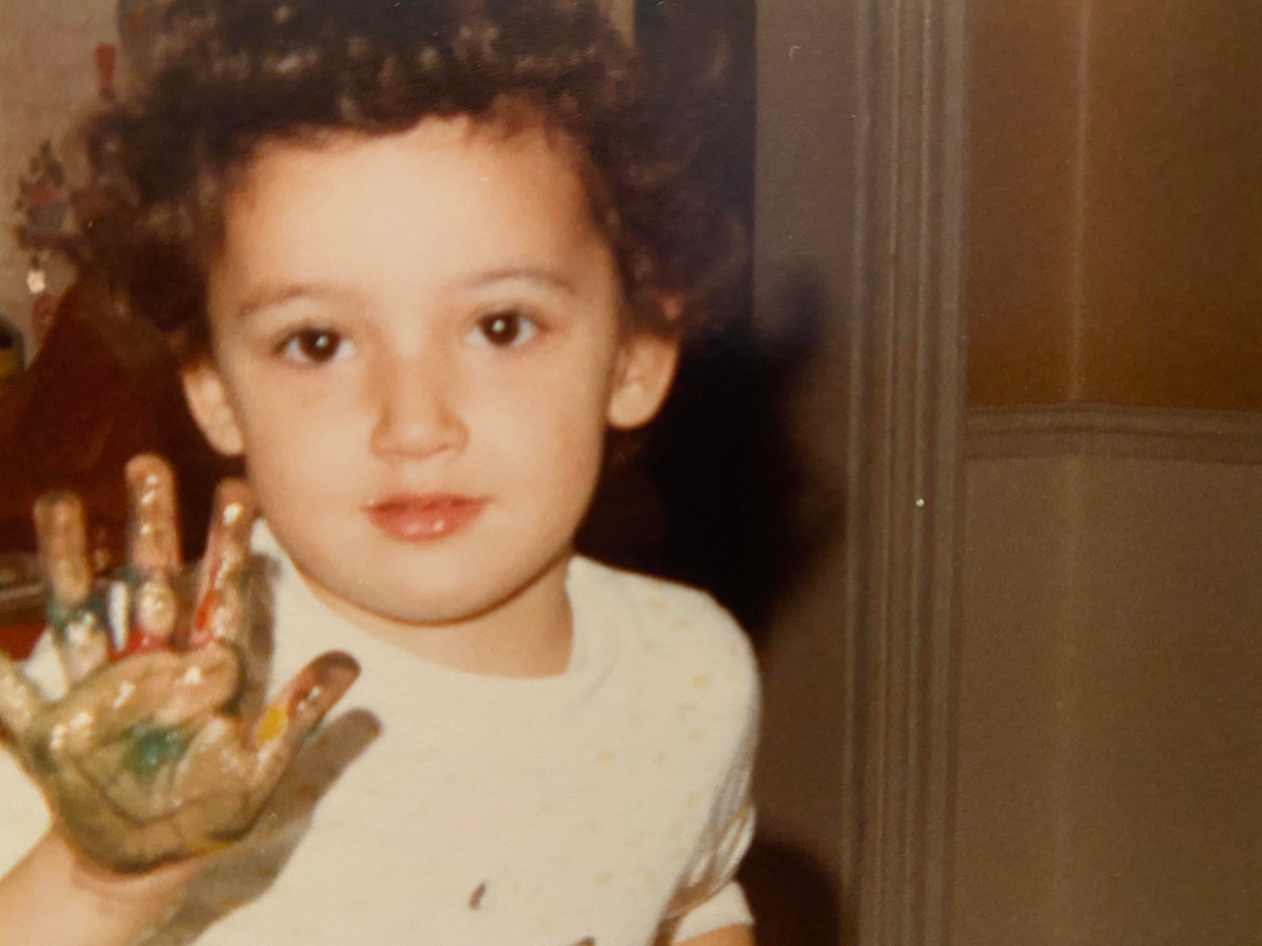 Brandy at age 2, finger-painting.