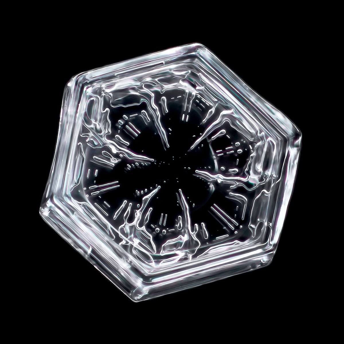 Small hexagonal plate snowflake.