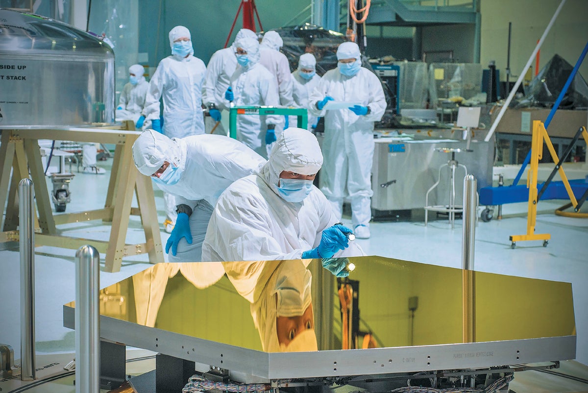 Technicians inspect one of the 18 hexagonal mirror segments that will form Webb’s primary mirror.
