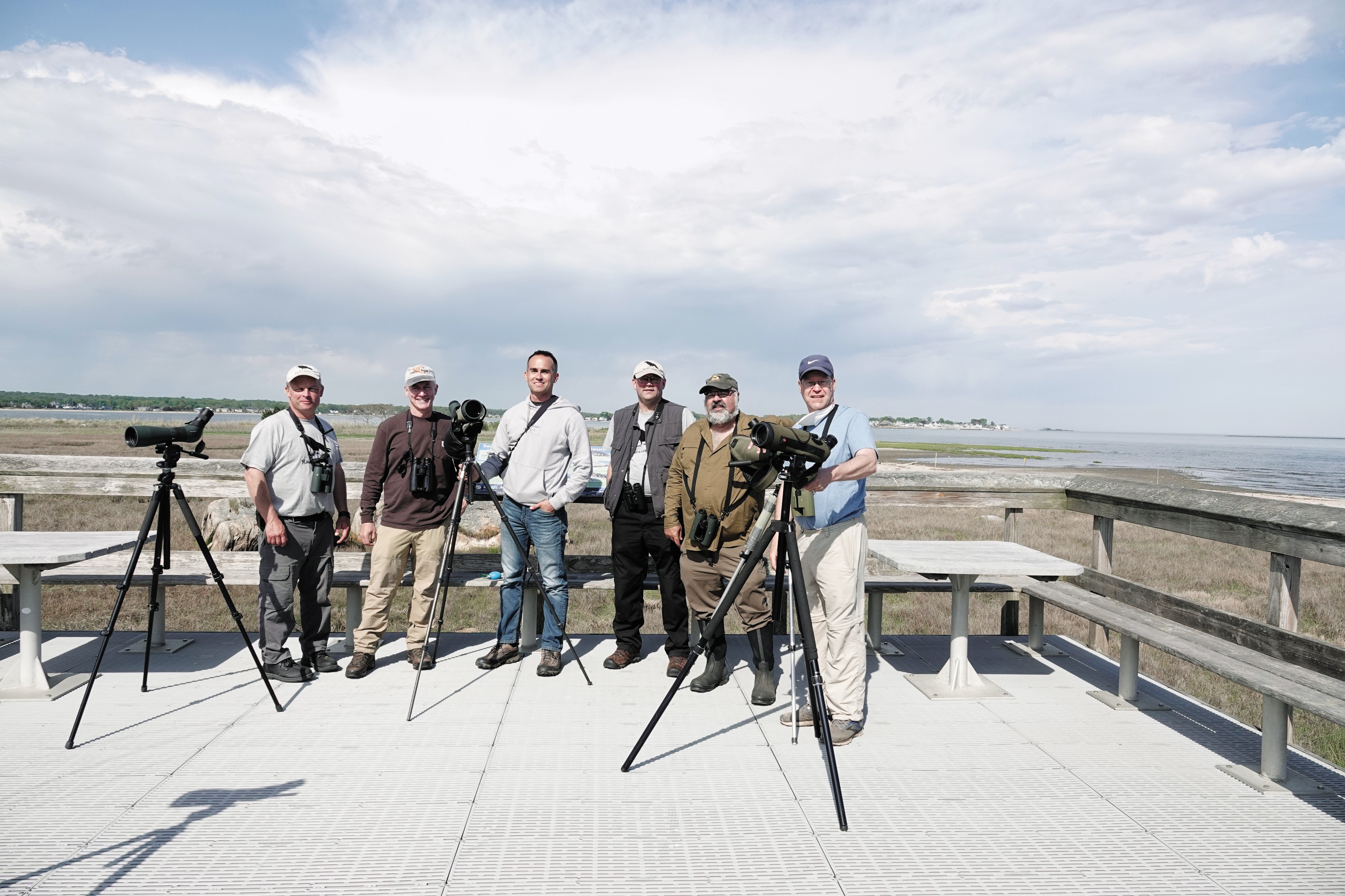 Group of people posing for camera.