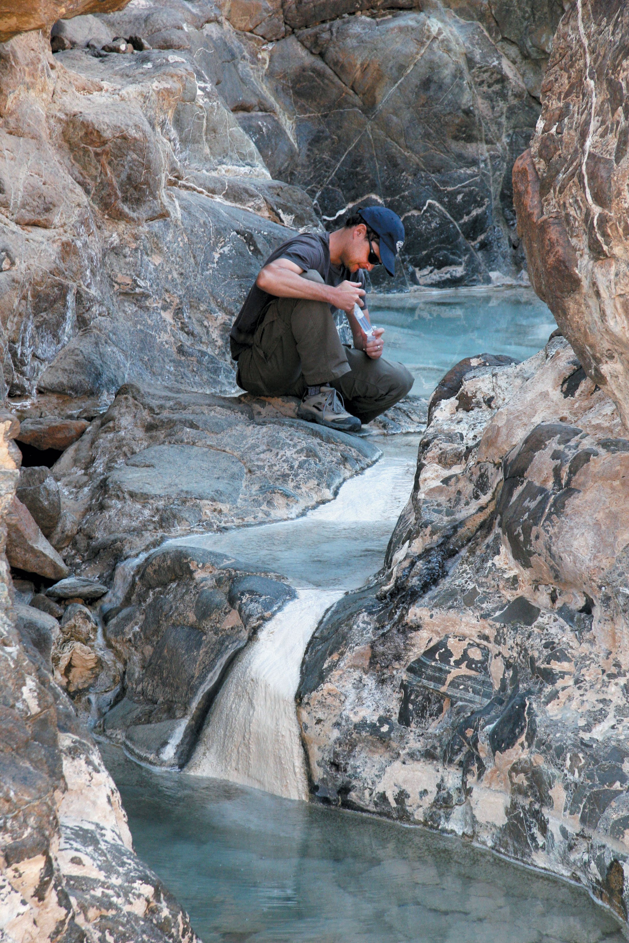 Researcher analyzing groundwater.