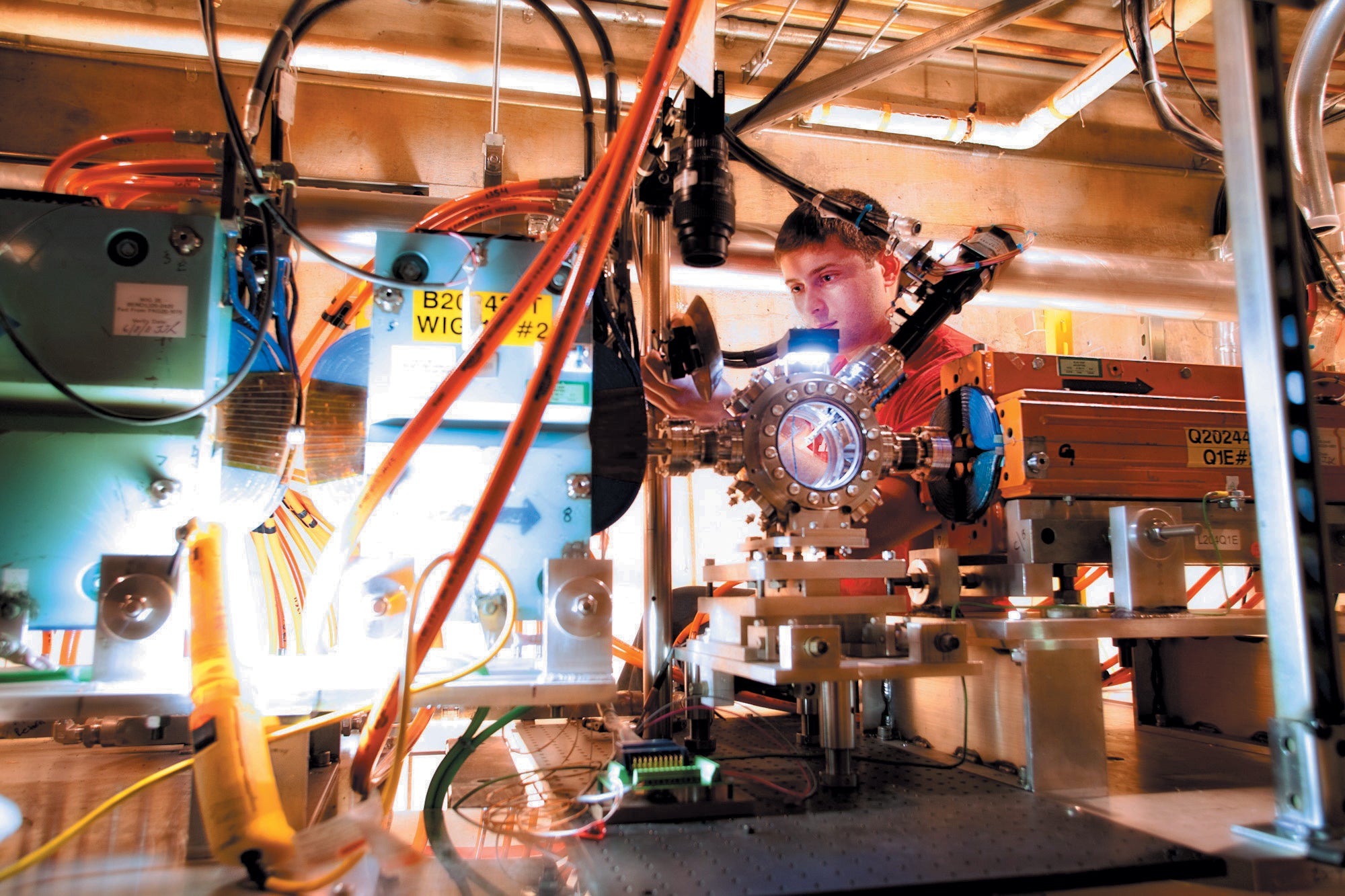 Scientist tests a prototype plasma accelerator.