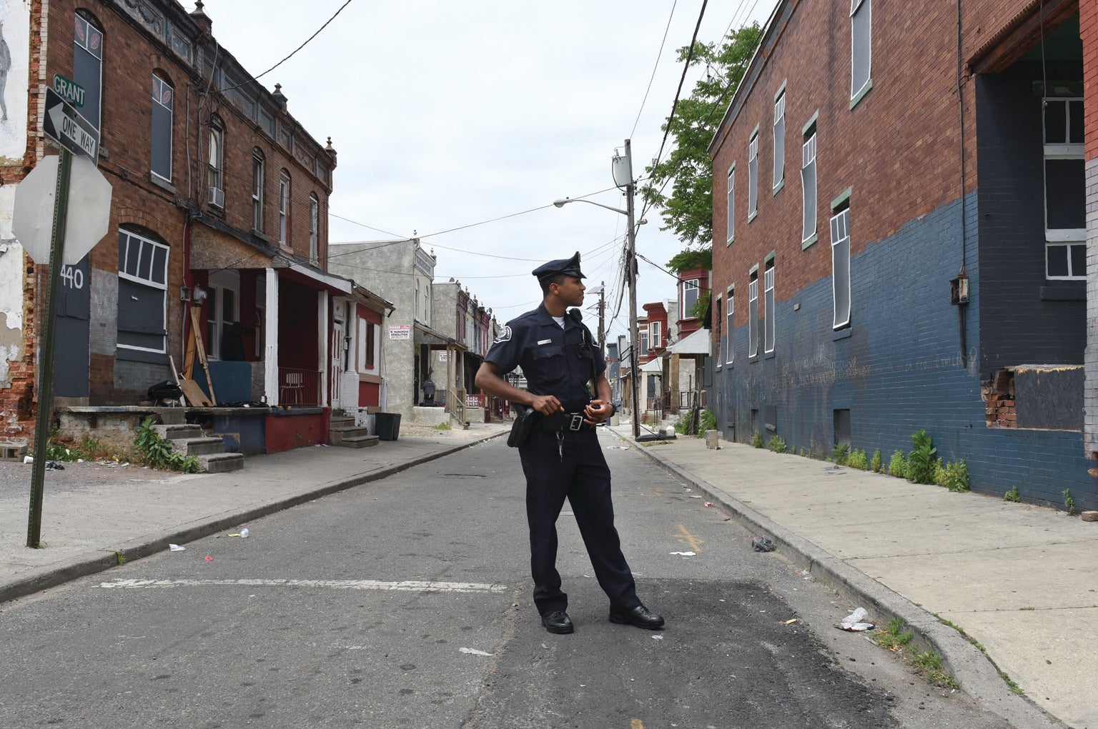 Police officer standing in the middle of the street. 