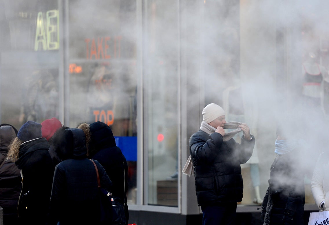 People out in the cold in Times Square, New York City.