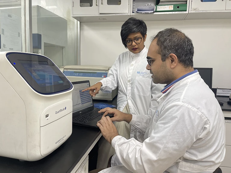 Woman and man working in a lab.