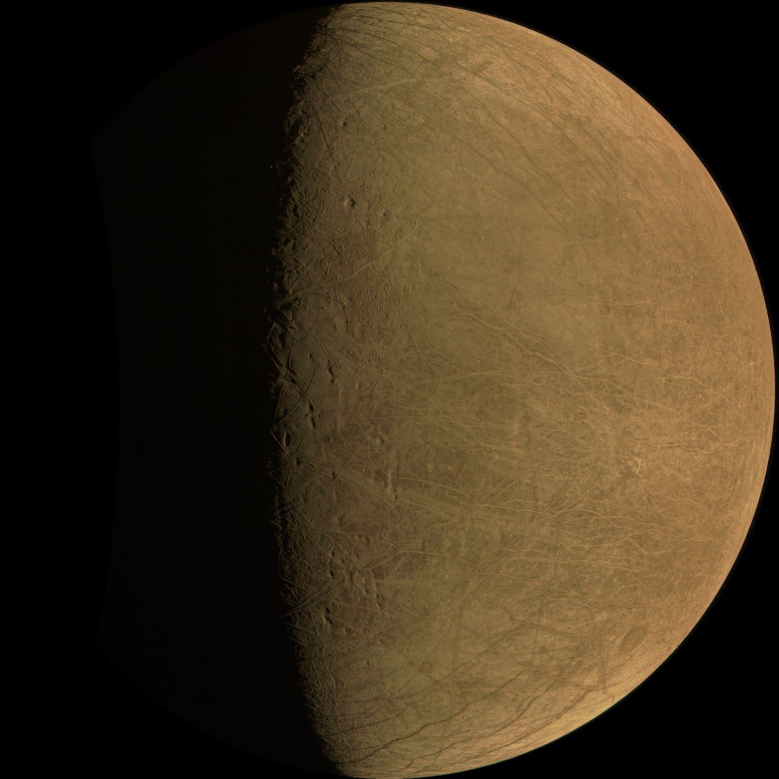 One of the four unprocessed images of Europa’s surface taken by the Juno probe. The moon appears uniformly pale orange because the camera’s color balance is optimized for Jupiter.