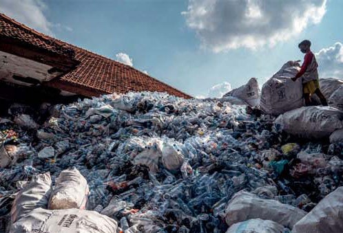 A worker sorts plastic bottles in Surabaya, Indonesia.